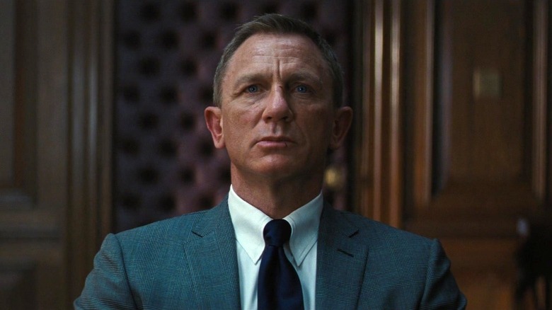 Daniel Craig as James Bond looking ahead in No Time to Die