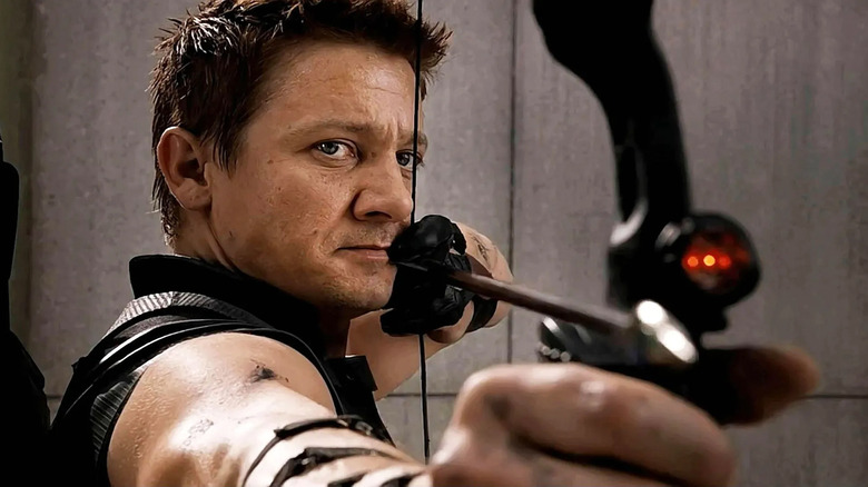 Jeremy Renner pointing his bow and arrow as Hawkeye in The Avengers