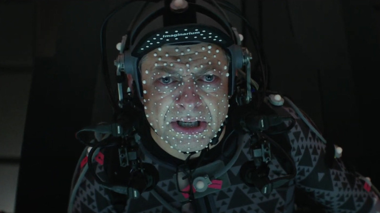 Andy Serkis doing motion capture as Supreme Leader Snoke sitting on his throne in Star Wars: The Last Jedi