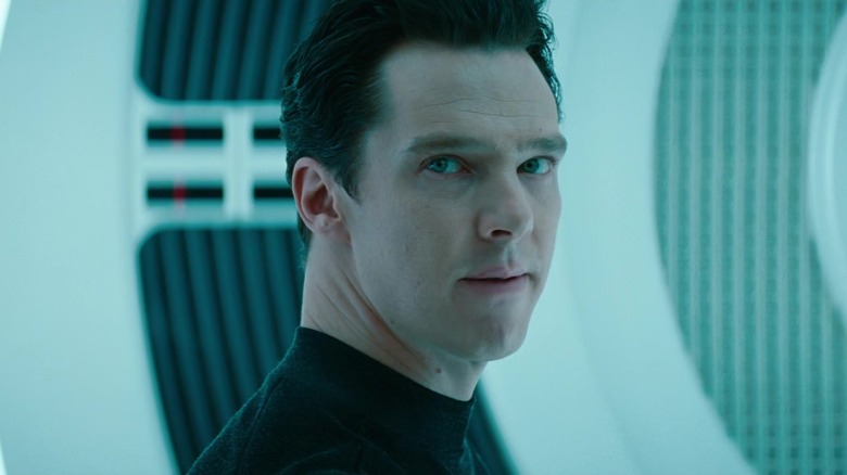 Benedict Cumberbatch as Kahn Noonien Singh looking over his shoulder in a cell in Star Trek into Darkness