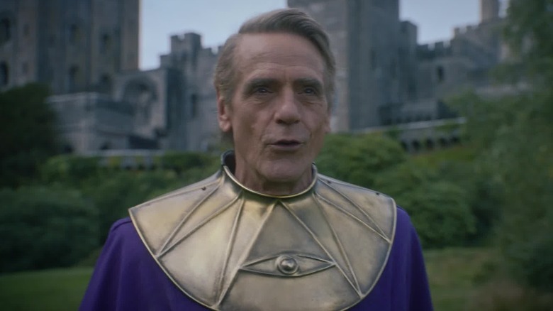 Jeremy Irons as Adrian Veidt, in costume as Ozymandias outside his castle in the 2019 Watchmen miniseries