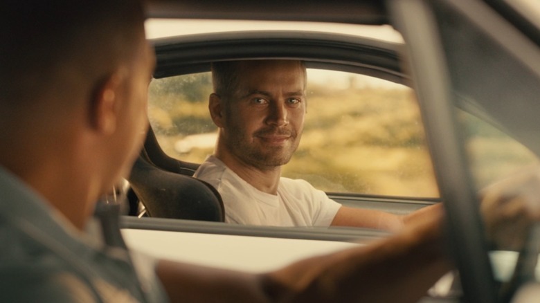 Brian smiles from the other car at the end of Furious 7