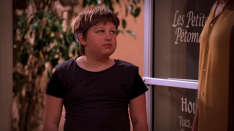 Angus T. Jones as Jake Harper side eyeing Charlie in Two and a Half Men