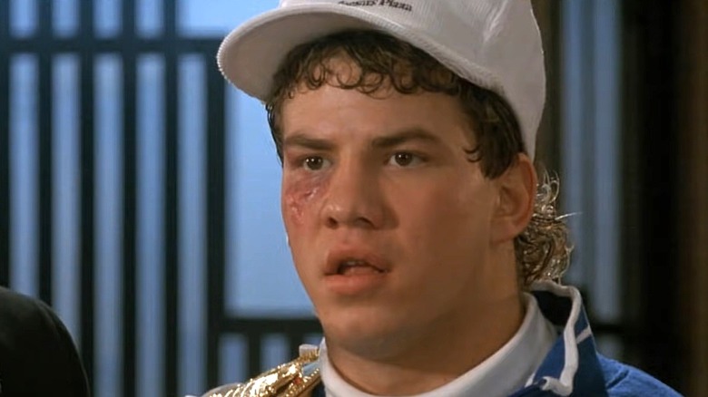 Tommy Morrison as Tommy Gunn wearing a cap and looking ahead in Rocky V