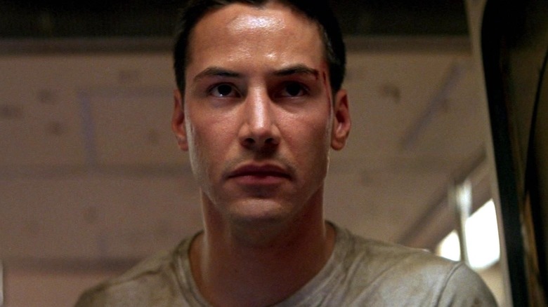 Keanu Reeves as Jack Traven staring ahead in Speed