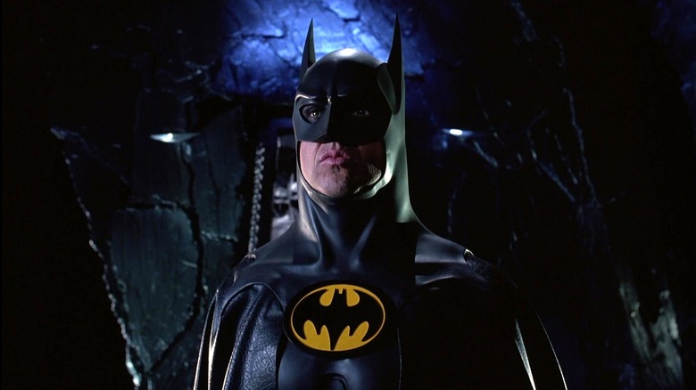 Michael Keaton as Batman posing in the cape and cowl in Batman Returns