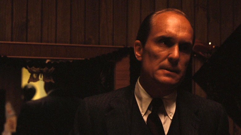 Robert Duvall as Tom Hagen grimacing in The Godfather Part II