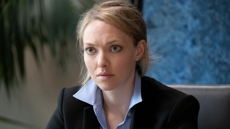 Elizabeth Holmes (Amanda Seyfried) looks up in a boardroom in The Dropout