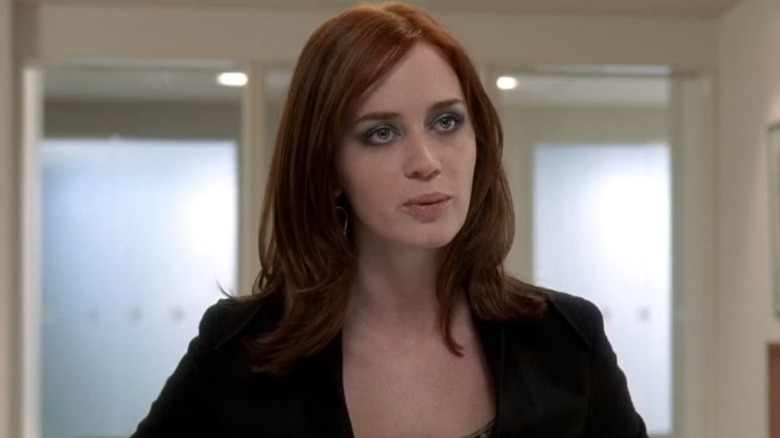 Emily Charlton (Emily Blunt) purses her lips in an office in The Devil Wears Prada