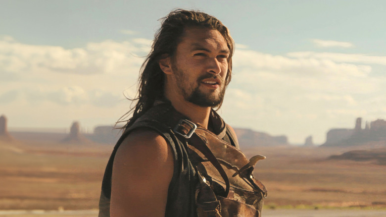 Robert Wolf (Jason Momoa) stands in the desert in Road to Paloma