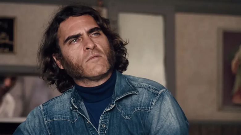 Doc Sportello (Joaquin Phoenix) looks up inquisitively in Inherent Vice