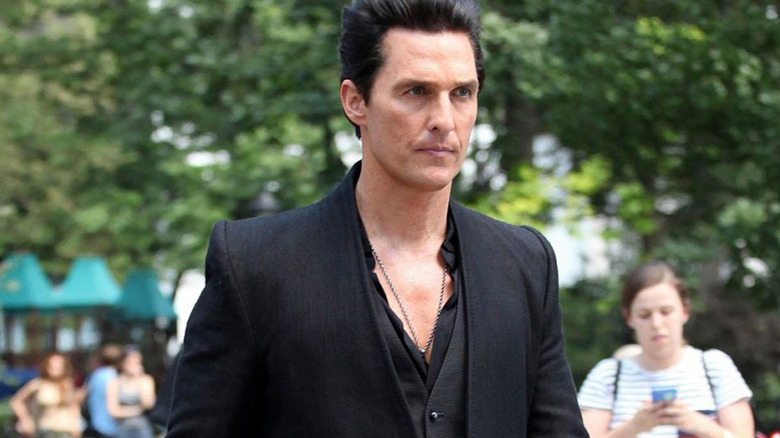 Walter Padick (Matthew McConaughey) walks through a park in The Dark Tower