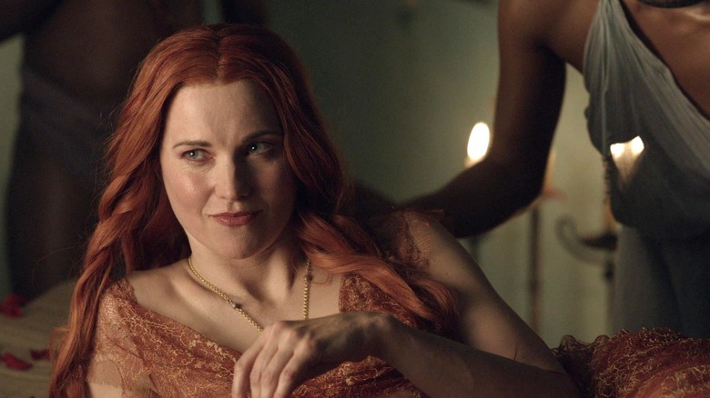 Lucy Lawless as Lucretia smirking in Spartacus