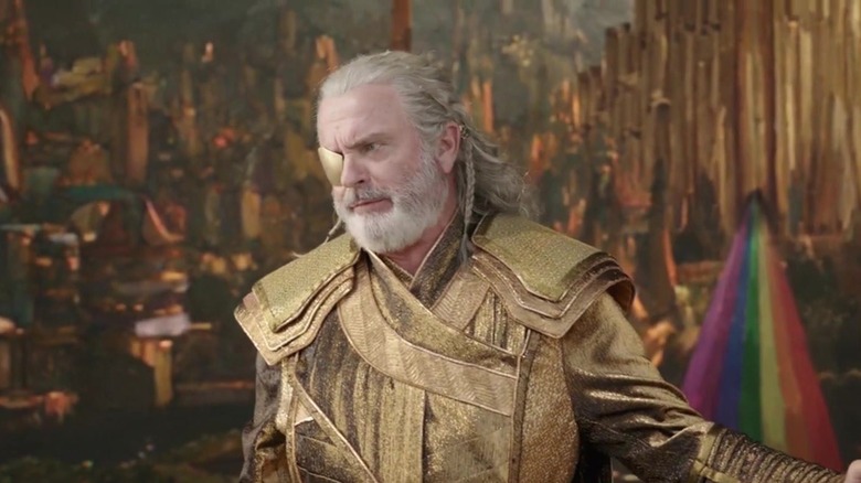 Sam Neill as Odin actor looking to the side in Thor: Ragnarok