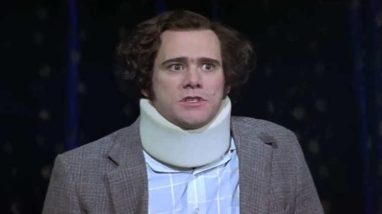 Jim Carrey as Andy Kaufman, wearing a neck brace