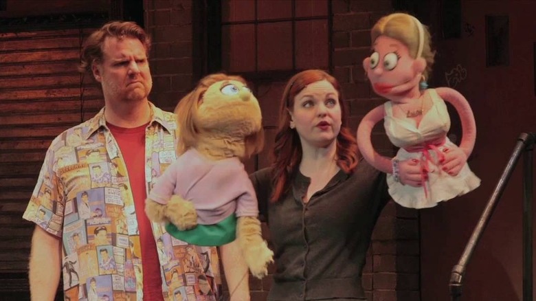 Puppets of Avenue Q with puppeteers