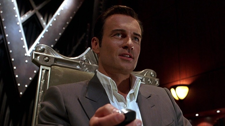 Julian McMahon as Victor Von Doom sitting in a chair in Fantastic Four