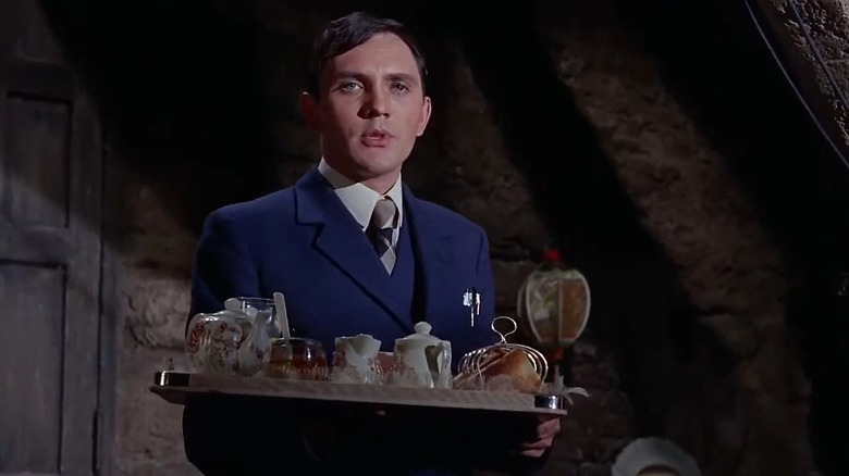 Terence Stamp as Freddie Clegg carrying a tray in The Collector