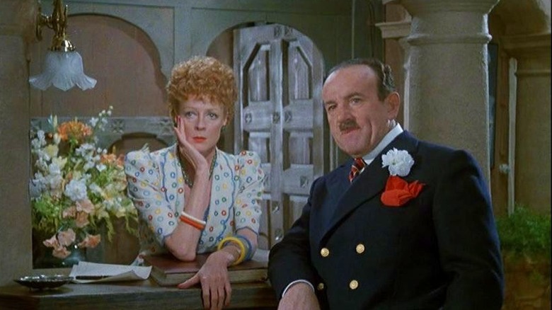 Daphne Castle (Maggie Smith) and Hercule Poirot (Peter Ustinov) looking forward in Evil Under the Sun