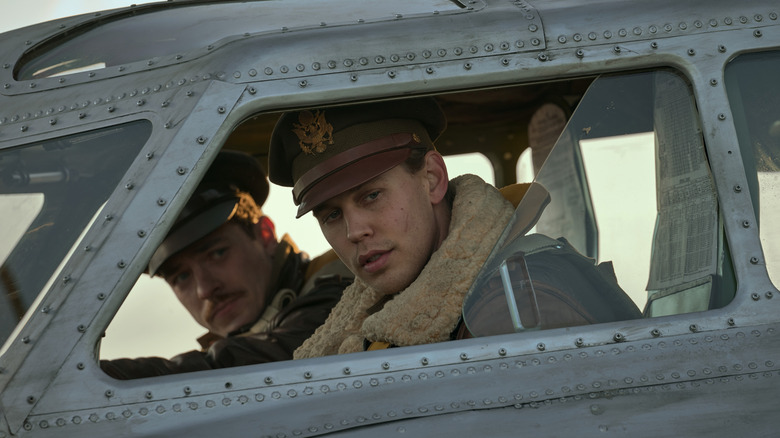 Austin Butler as Major Gale "Buck" Cleven and Nate Mann as Major Robert "Rosie" Rosenthal in the cockpit of an airplane in Masters of the Air.