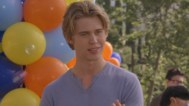 Austin Butler as James "Wilke" Wilkerson smiling at a party in Switched at Birth.