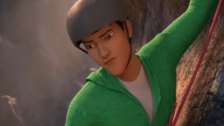 Kenji Kon, voiced by Darren Barnet, climbing the side of a mountain