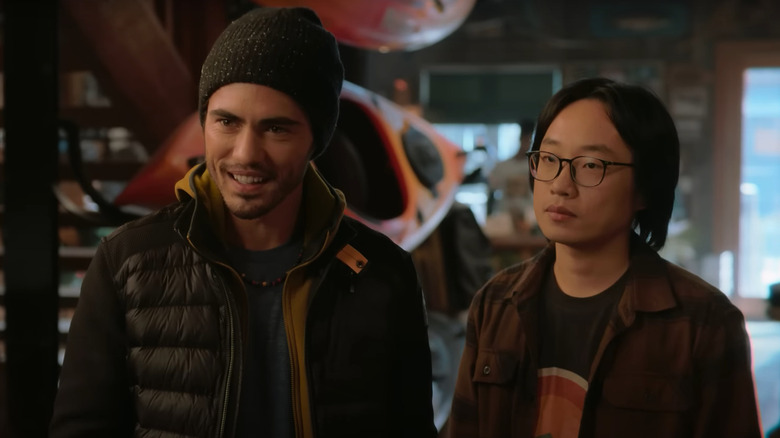 Darren Barnet and Jimmy O. Yang as Tag and Josh talking in a sporting goods store in Love Hard