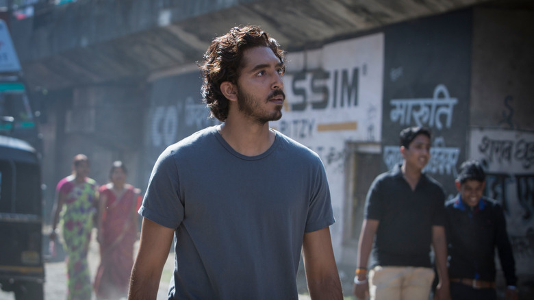 Saroo walking through streets of India in Lion