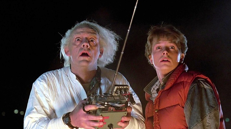 Christopher Lloyd as Doc Brown looking shocked and Michael J. Fox as Marty McFly looking surprised in Back to the Future