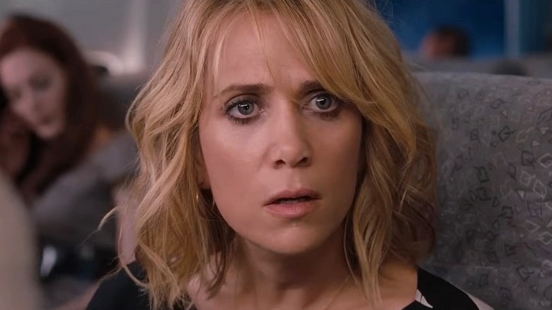 Kristen Wiig as Annie Walker staring on the plane in Bridesmaids