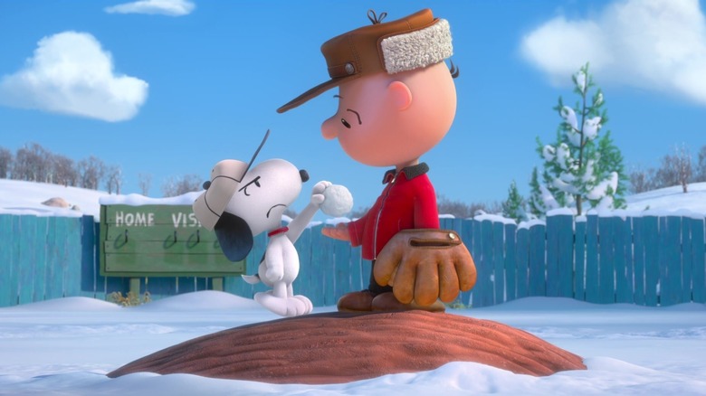 Snoopy handing a snowball to Charlie Brown in The Peanuts Movie