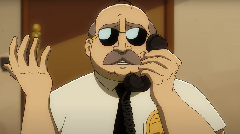 Flute Cop, the character voiced by Ken Marino, speaking on a prison telephone on Axe Cop