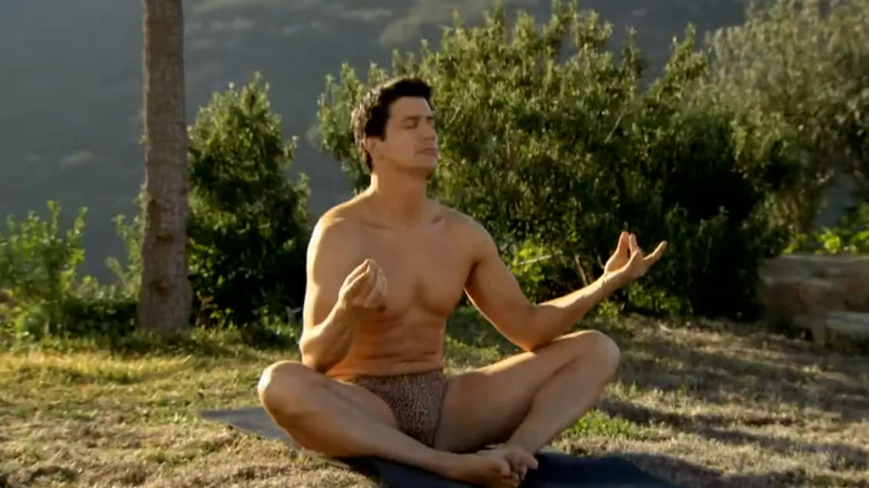 Ken Marino as Mark Orlando meditating outdoors on Burning Love