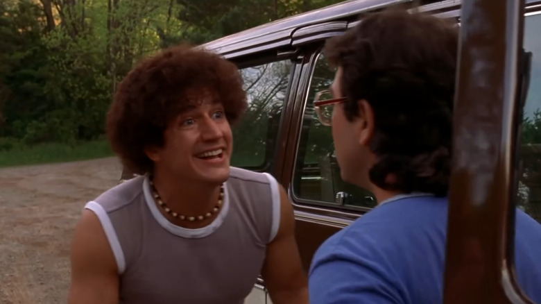 Ken Marino and Joe Lo Truglio as Viktor and Neil speaking next to a van in the forest in Wet Hot American Summer