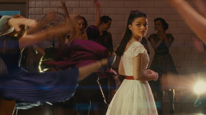 Maria looks over her shoulder in West Side Story (2021)