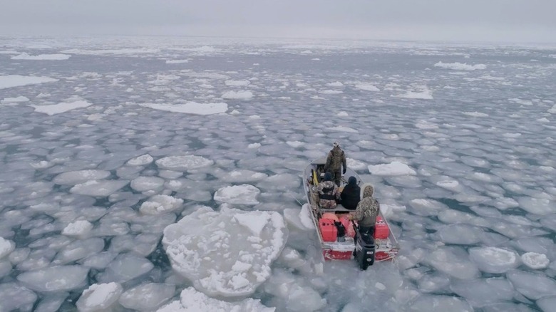 A small boat with whalers on the hunt in One With the Whale