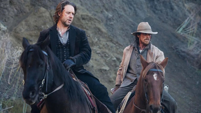 Dan Evans (Christian Bale) escorts Ben Wade (Russell Crowe) in 3:10 to Yuma