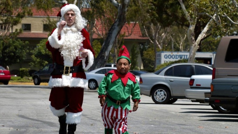 Willie T. Stoke (Billy Bob Thornton ) and Marcus Skidmore (Tony Cox) walk in parking lot in Bad Santa