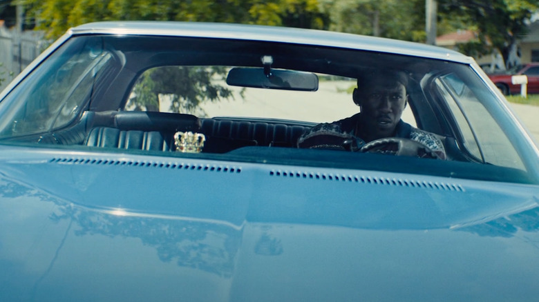 Mahershala Ali as Juan sits in a car in Moonlight