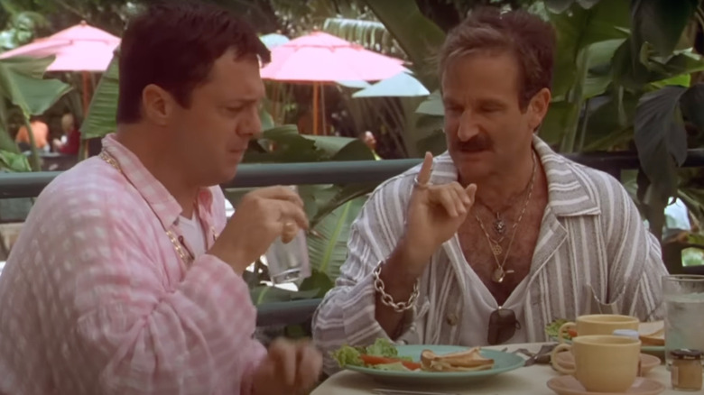 Nathan Lane as Albert and Robin Williams as Armand eat at a table in The Birdcage