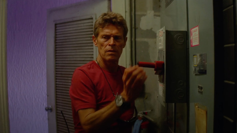 Willem Dafoe as Bobby Hicks flips a switch in The Florida Project