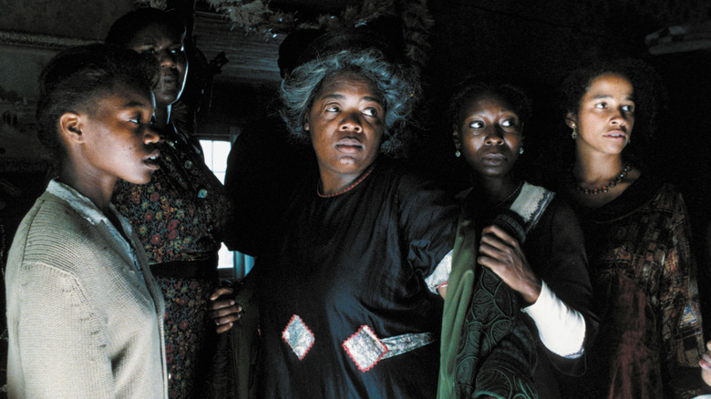 The cast of The Color Purple including Oprah Winfrey as Sofia, Whoopi Goldberg as Celie, and Rae Dawn Chong as Squeak