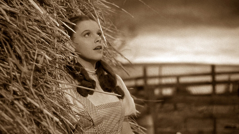 Dorothy (Judy Garland) sings next to hay bail in The Wizard of Oz