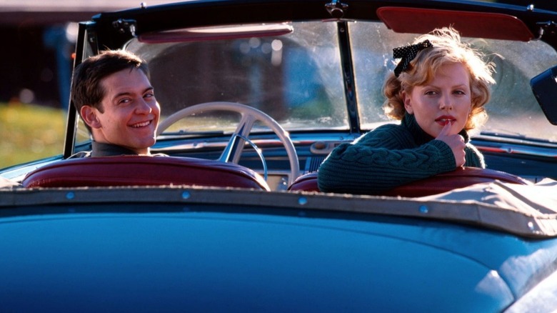 Tobey Maguire as Homer Wells sits in a car next to Charlize Theron as Candy in The Cider House Rules