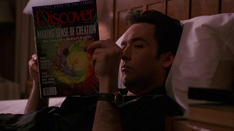 Martin Blank reads a magazine in Grosse Pointe Blank