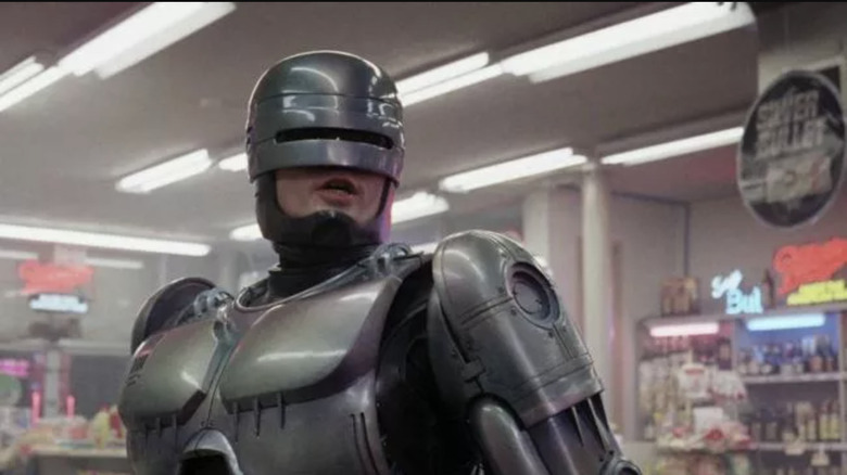 Robocop speaks inside a convenience store in RoboCop