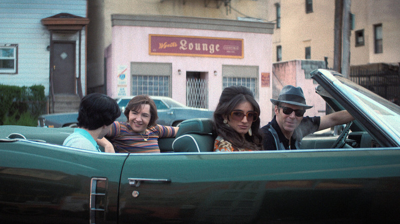 Tony, Giuseppina, and Dickie sitting in a green convertible in The Many Saints of Newark