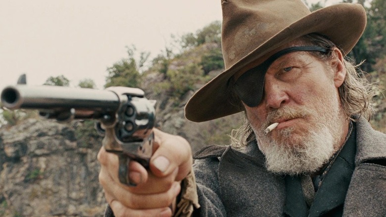 Rooster Cogburn (Jeff Bridges) points pistol in True Grit