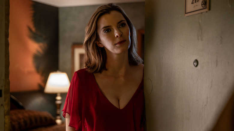 Betty Gilpin as Lina in red blouse in Three Women