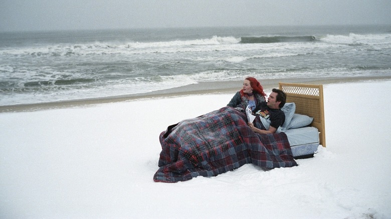 Eternal Sunshine of the Spotless Mind's Jim Carrey and Kate Winslet in bed on snowy beach